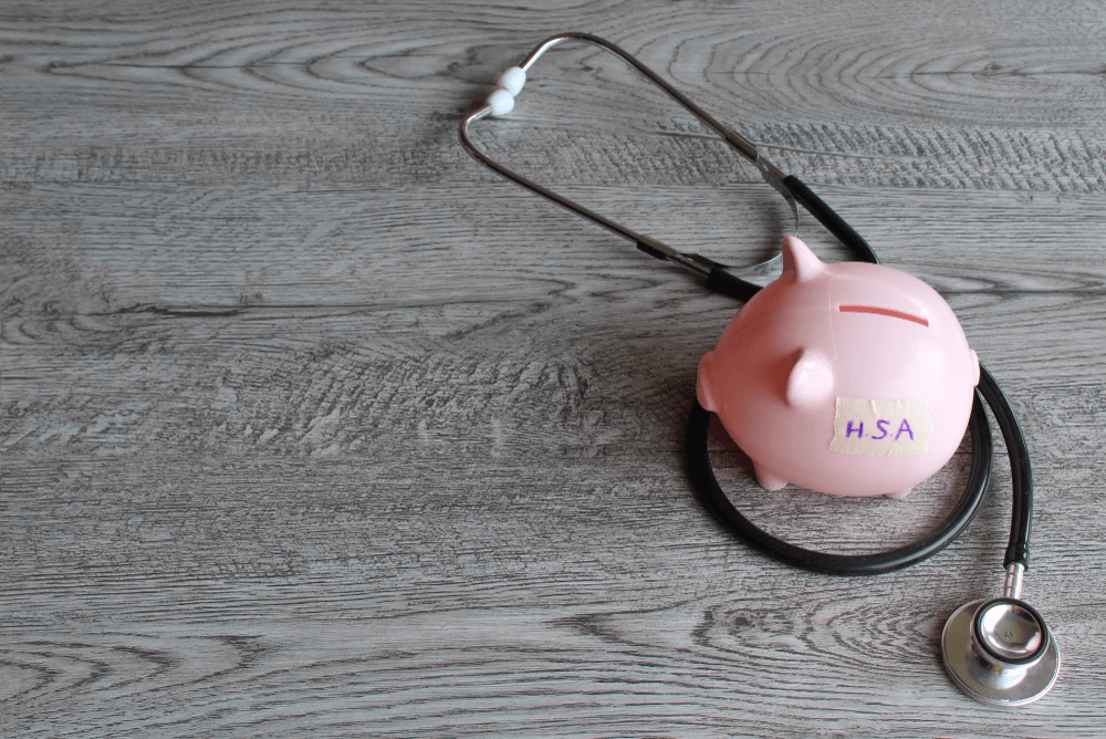 HSA savings piggy bank with a stethascope around it